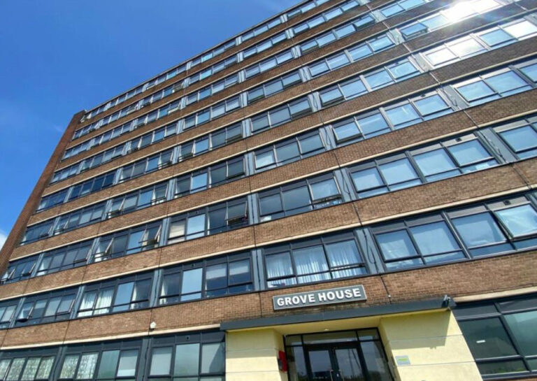 Grove House, Manchester: the nine-storey brick facade above the main entrance