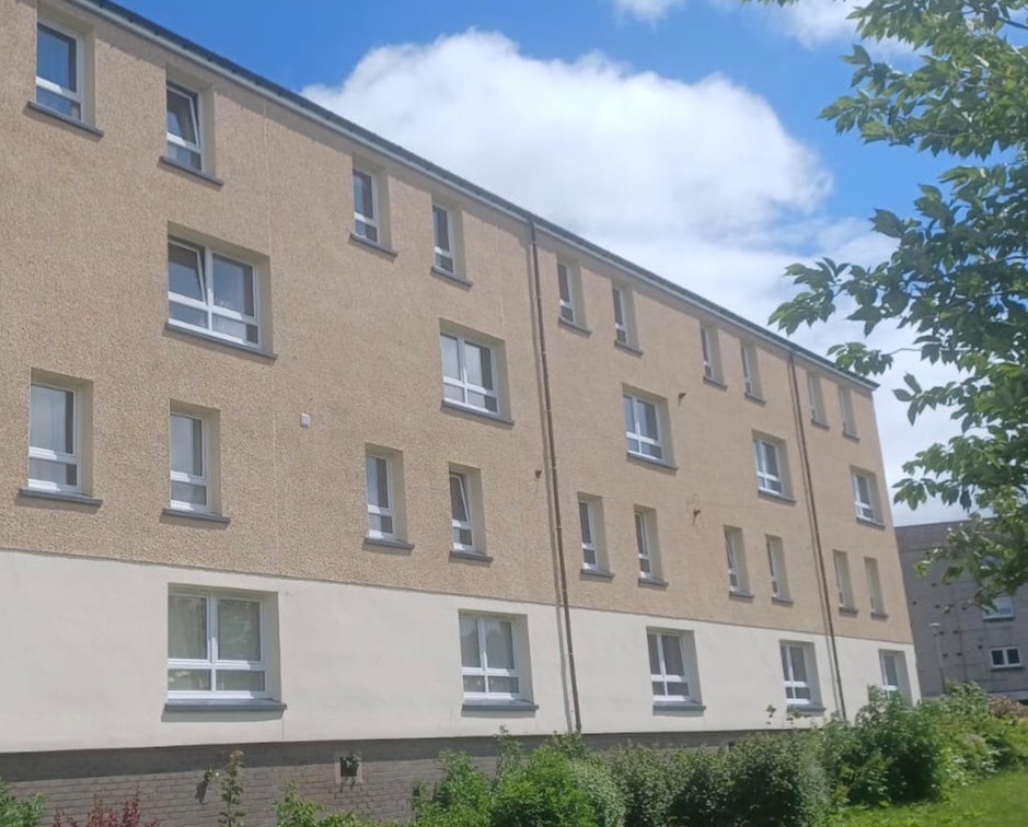Oxgangs House, Edinburgh: the rendered block of maisonettes with new windows